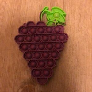 Grape Pop it toy.